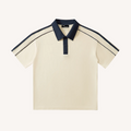 Beige polo shirt with navy accents on a white background