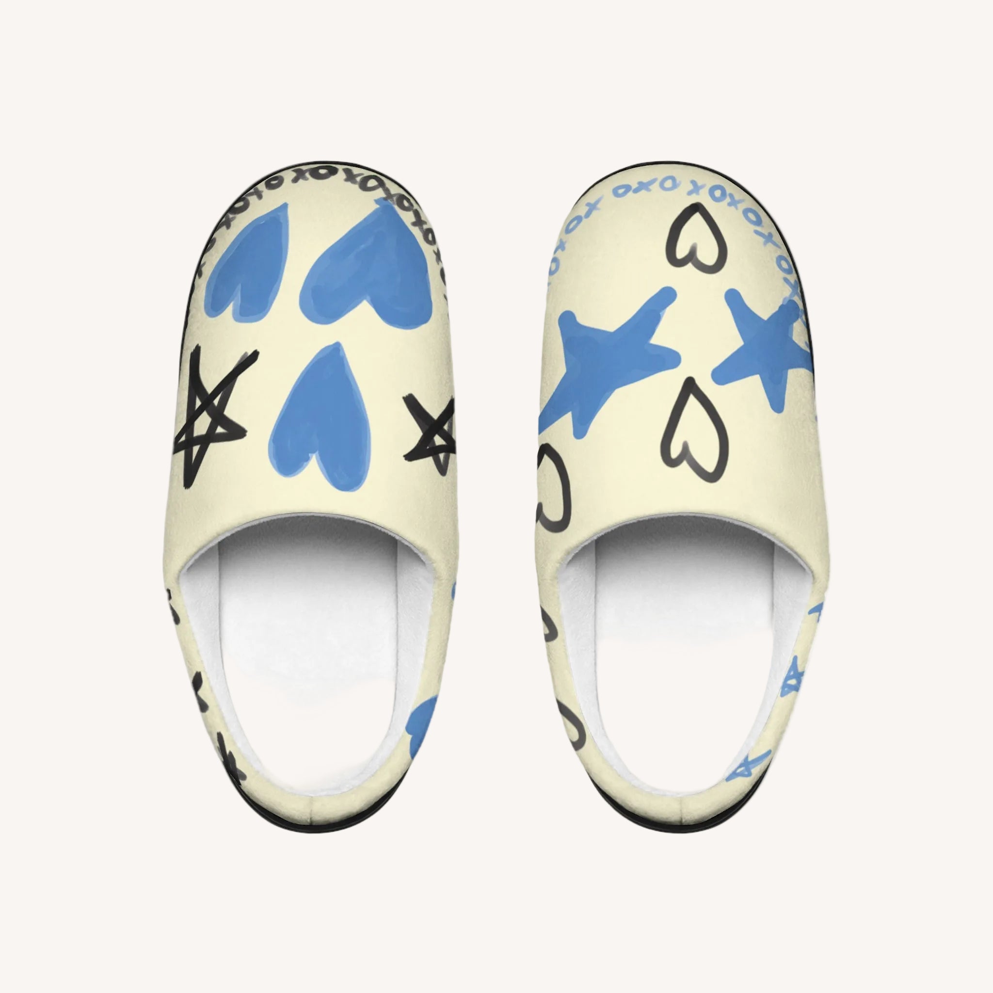 Pair of slippers with blue hearts and stars on a white background