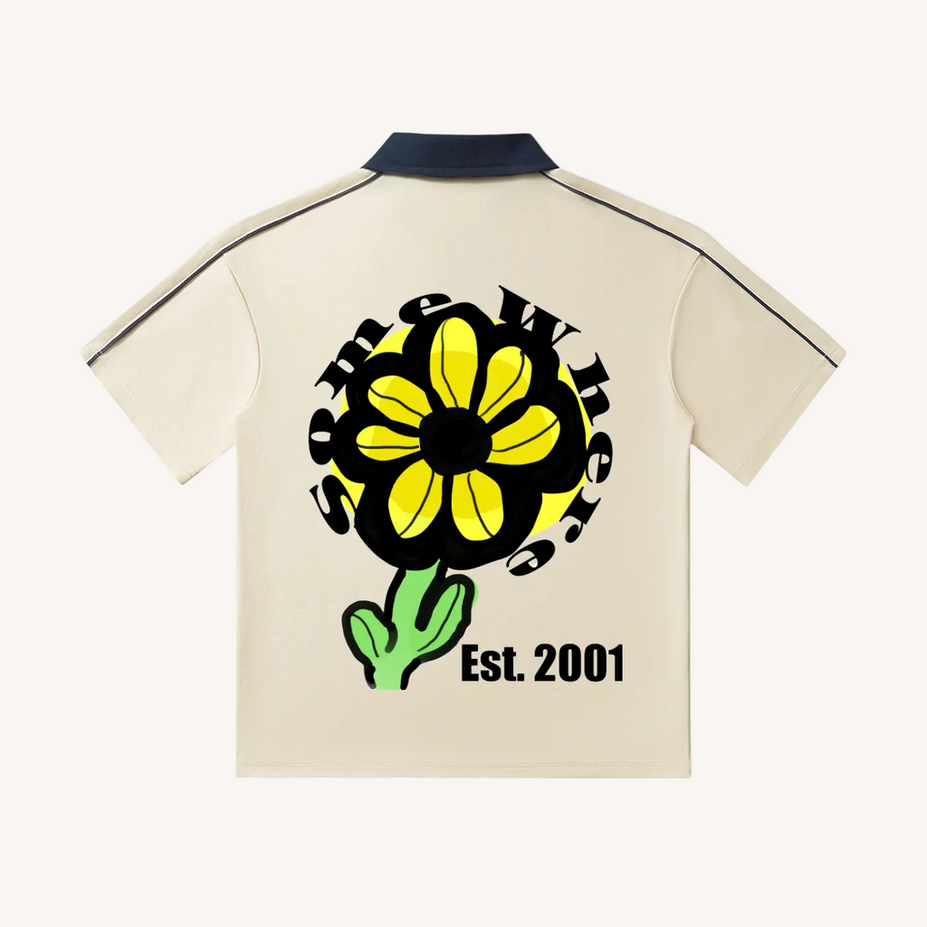 Beige shirt with a yellow flower graphic and 'Est. 2001' text on a white background