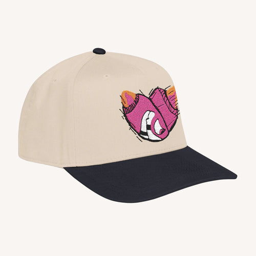 Beige and black cap with a pink and orange fox design on a white background