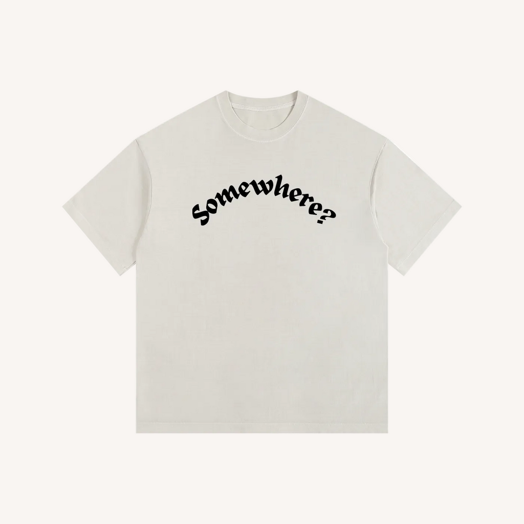 Beige t-shirt with black text 'Somewhere?' on a white background