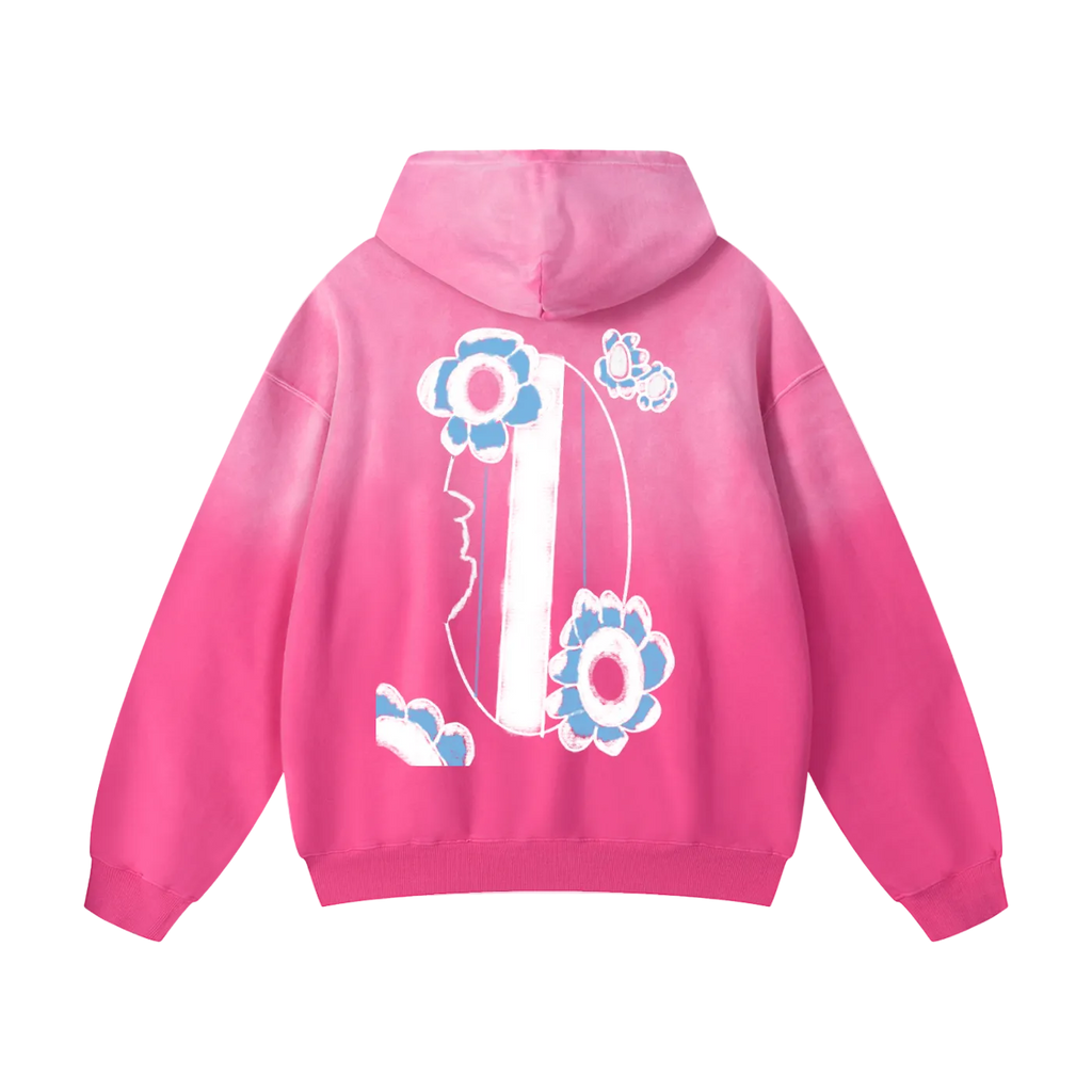 Pink hoodie with floral designs on the back against a white background