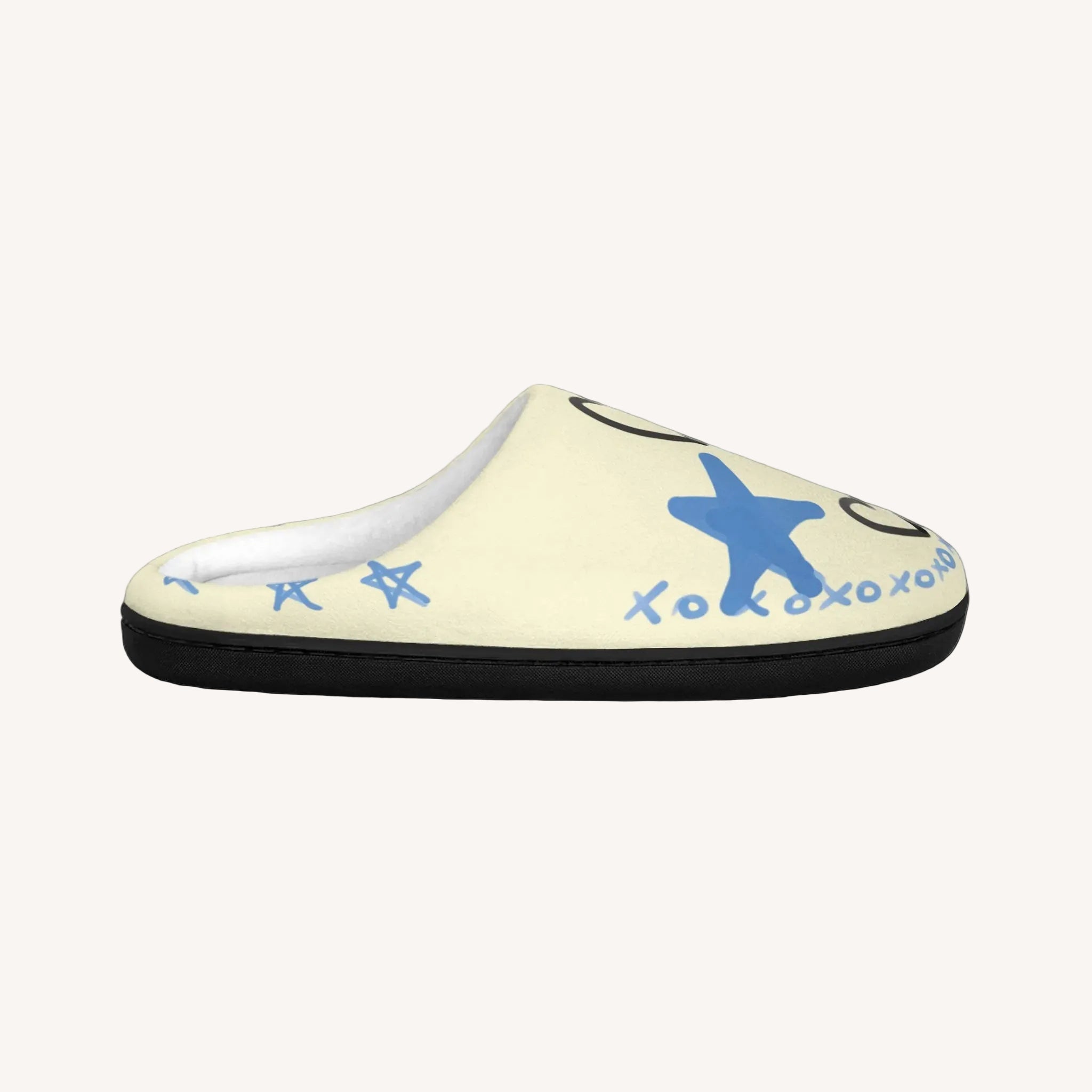 Beige slipper with blue starfish design on a white background