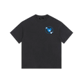Black t-shirt with a small graphic on the chest against a white background
