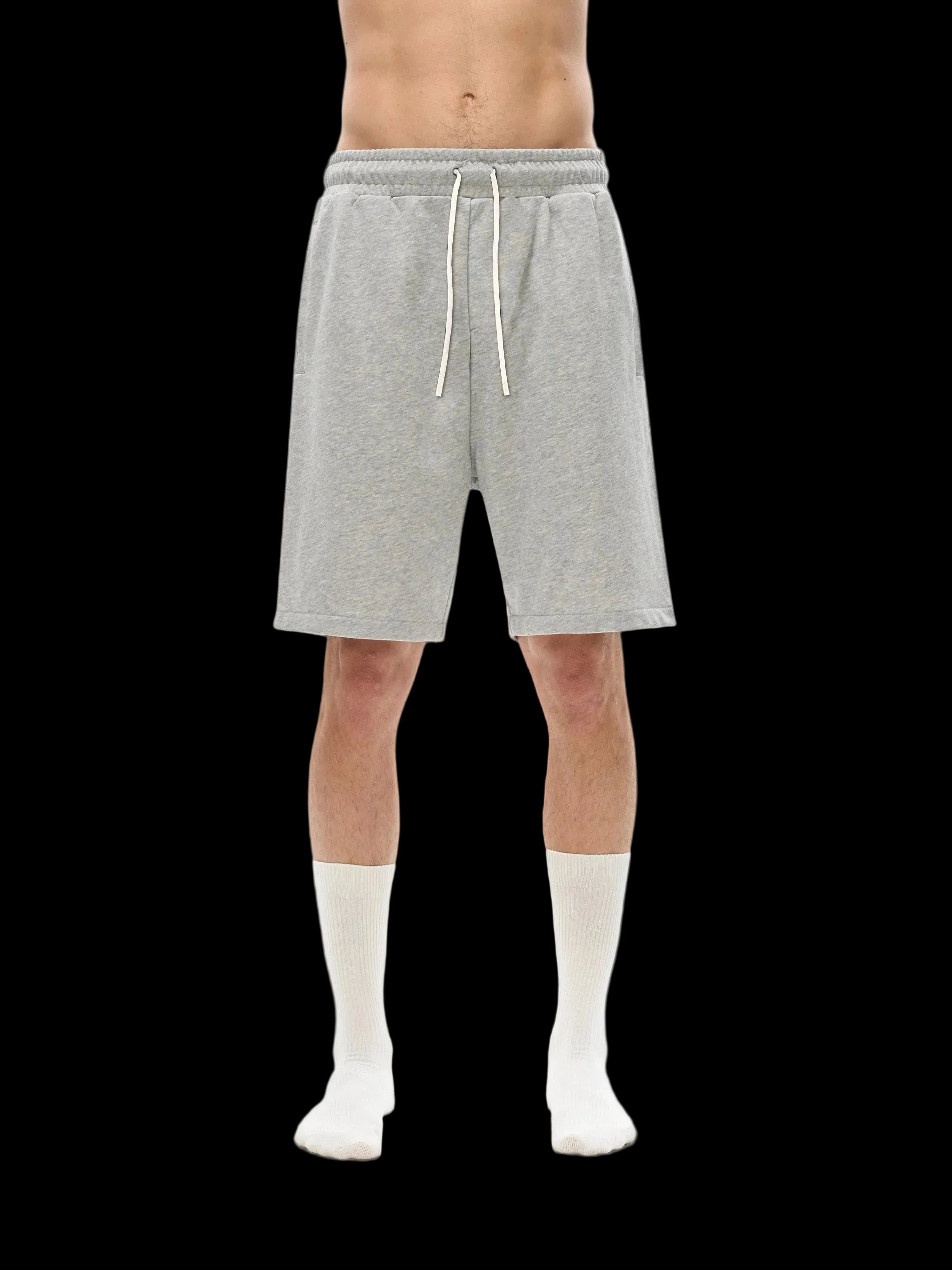 Person wearing gray shorts on a white background